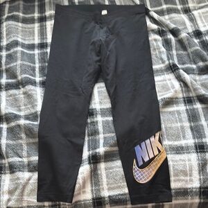 Nike leggings with orange/purple logo